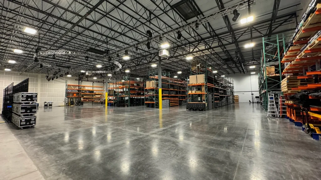 Encompass team hosting partners during a behind-the-scenes facility tour in Colorado focused on live event production and technical preparation.