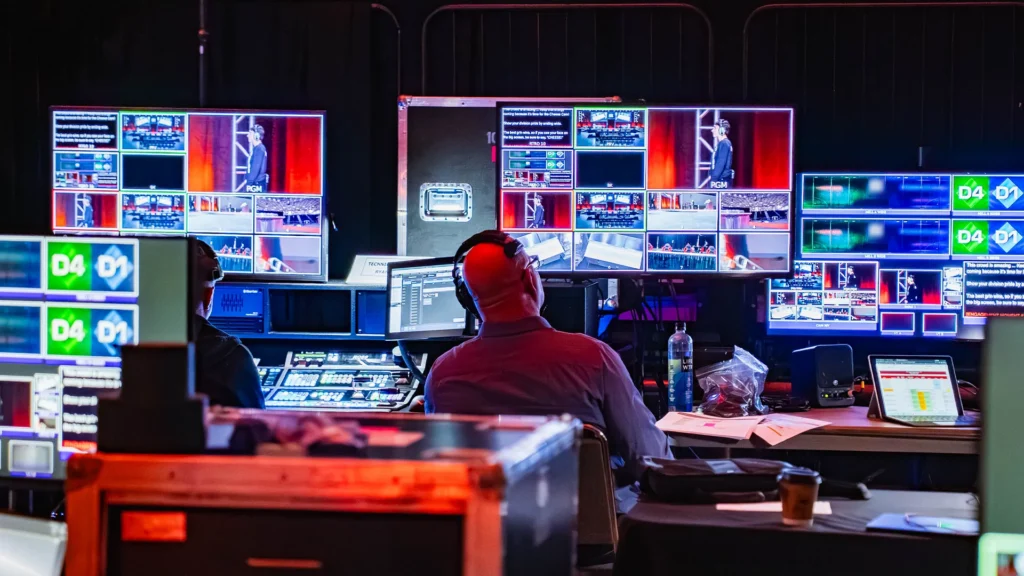 Encompass Event Group technicians managing live video feeds at the event production control station