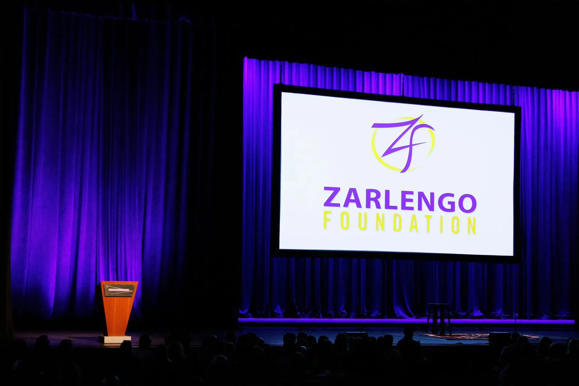 Zarlengo Foundation Evening of Comedy stage screen and podium setup